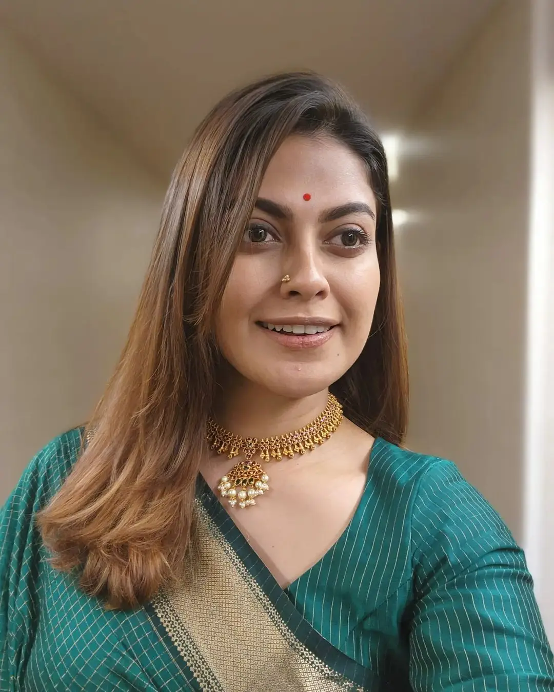 Anusree Nair Wearing Beautiful Earrings Jewellery Green Saree Blouse